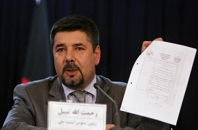 Rahmatullah Nabil, head of Afghanistan's National Directorate Of Security (NDS), shows a paper during a joint news conference in Kabul September 7, 2011. REUTERS/Omar Sobhani