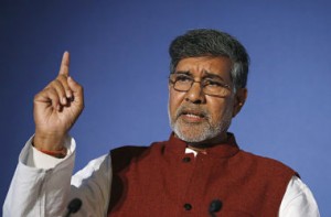 Nobel peace laureate and children's rights activist Kailash Satyarthi gestures while speaking at the Trust Women conference in London November 19, 2014. Satyarthi called on Monday for global support for a campaign to end child slavery that will be launched this week as new figures estimated almost 36 million people are living as slaves today. REUTERS/Suzanne Plunkett (BRITAIN - Tags: SOCIETY) - RTR4EPF6