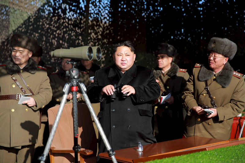 North Korean leader Kim Jong Un (C) watches a firing contest of the KPA artillery units at undisclosed location in this photo released by North Korea's Korean Central News Agency (KCNA) in Pyongyang on January 5, 2016. REUTERS/KCNA    ATTENTION EDITORS - THIS PICTURE WAS PROVIDED BY A THIRD PARTY. REUTERS IS UNABLE TO INDEPENDENTLY VERIFY THE AUTHENTICITY, CONTENT, LOCATION OR DATE OF THIS IMAGE. FOR EDITORIAL USE ONLY. NOT FOR SALE FOR MARKETING OR ADVERTISING CAMPAIGNS. THIS PICTURE IS DISTRIBUTED EXACTLY AS RECEIVED BY REUTERS, AS A SERVICE TO CLIENTS. NO THIRD PARTY SALES. SOUTH KOREA OUT. NO COMMERCIAL OR EDITORIAL SALES IN SOUTH KOREA