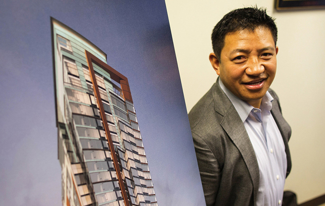 Lobsang Dargey (cq), CEO of Dargey Development and Path America, is seen next to one of his projects in his office on Thursday, November 6, 2014, in Bellevue. 

LOBSANG DARGEY - CEO DARGEY DEVELOPMENT AND PATH AMERICA - 142807 - 110614