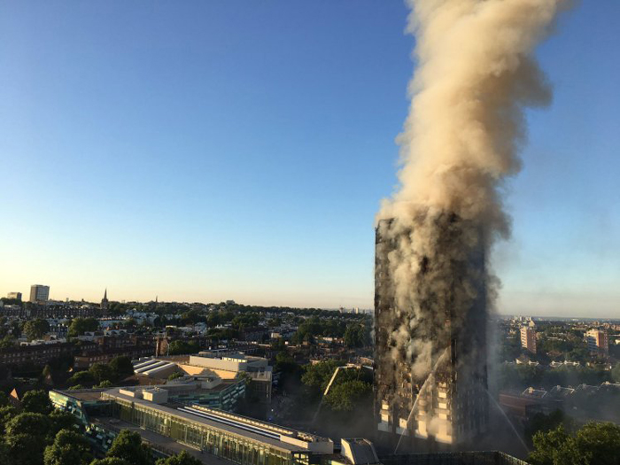 This handout image received by local resident Natalie Oxford early on June 14, 2017 shows flames and smoke coming from a 27-storey block of flats after a fire broke out in west London. The fire brigade said 40 fire engines and 200 firefighters had been called to the blaze in Grenfell Tower, which has 120 flats. / AFP PHOTO / Natalie Oxford / Natalie OXFORD / -----EDITORS NOTE --- RESTRICTED TO EDITORIAL USE - MANDATORY CREDIT "AFP PHOTO / Natalie Oxford" - NO MARKETING - NO ADVERTISING CAMPAIGNS - DISTRIBUTED AS A SERVICE TO CLIENTS - NO ARCHIVESNATALIE OXFORD/AFP/Getty Images