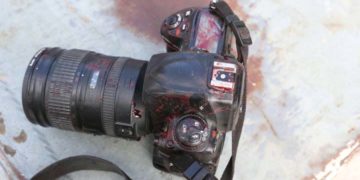 ATTENTION EDITORS - VISUALS COVERAGE OF SCENES OF DEATH OR INJURY - The blood stained camera of a photojournalist is seen after a secondary explosion in front of Dayah hotel in Somalia's capital Mogadishu, January 25, 2017. REUTERS/Feisal Omar