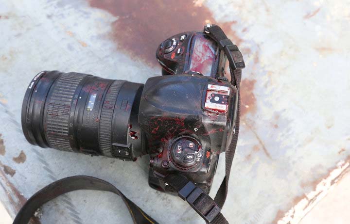 ATTENTION EDITORS - VISUALS COVERAGE OF SCENES OF DEATH OR INJURY - The blood stained camera of a photojournalist is seen after a secondary explosion in front of Dayah hotel in Somalia's capital Mogadishu, January 25, 2017. REUTERS/Feisal Omar