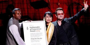 Aung San Suu Kyi collects the Amnesty International Ambassador of Conscience award (2009) at the Electric Burma Concert held her in honour in Dublin, Ireland, 18 June 2012. 
Aung San Suu Kyi was presented with the award by Bono and Amnesty International Secretary General Salil Shetty.