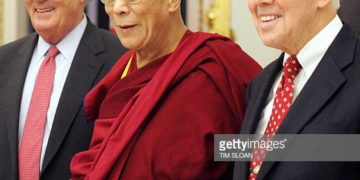 Washington, UNITED STATES:  The Dalai Lama (C), the Tibetan spiritual leader, stands with US Senate Foreign Relations Committee chairman Senator Richard Lugar (R), R-IN, and ranking member Senator Paul Sarbanes, D-MD, as he meets with the committee 16 November 2005 on Capitol Hill in Washington. The Dalai Lama, who arrived here 08 November on a high-profile 10-day visit that included talks with US President George W. Bush and Secretary of State Condoleezza Rice, is spending the day at the US Capitol to meet with congressional leaders.   AFP PHOTO/Tim SLOAN  (Photo credit should read TIM SLOAN/AFP/Getty Images)