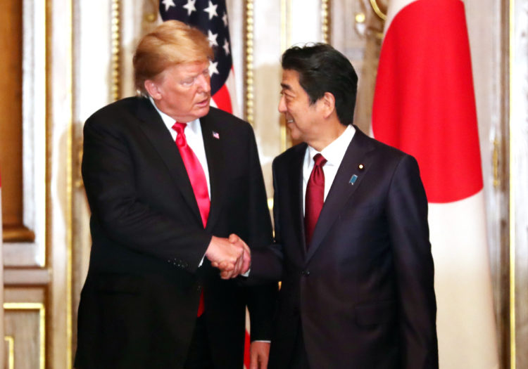 TOKYO, JAPAN - MAY 27: U.S. President Donald Trump (L) shakes hands with Japanese Prime Minister Shinzo Abe prior to their working luncheon at the Akasaka guesthouse in Tokyo on May 27, 2019 in Tokyo, Japan. President Donald Trump is on the third day of a four day state visit to Japan, the first official visit of the country's Reiwa era. Alongside a number of engagements, Mr Trump was guest of honour at a Sumo wrestling match on Sunday and is expected to meet families of North Korean abductees. (Photo by Yoshikazu Tsuno - Pool/Getty Images)