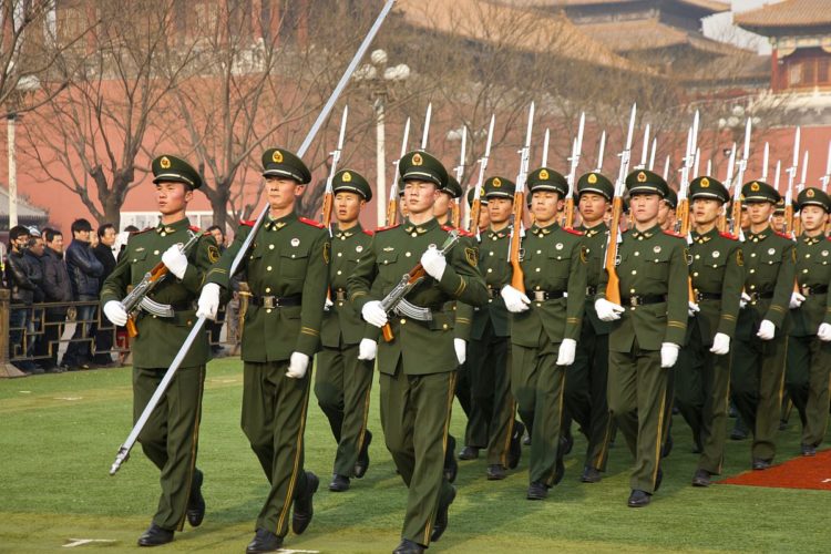 "Beijing, China - December 27, 2011. Young soldiers marching in the Forbidden City."