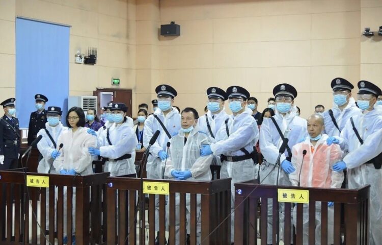 This handout photograph taken on April 30, 2020 and received on May 1 from the Hunan Province Higher People's Court, shows journalist Chen Jieren (C) and fellow defendants Liu Min (L) and Chen Weiren (R) during their sentencing at the People's Court of Guiyang county in China's Hunan province. - Chen Jieren, a journalist who had worked for some of China's most powerful propaganda outlets, has been jailed for 15 years after being accused of attacking the ruling Communist Party, court documents showed. (Photo by HANDOUT / Hunan Province Higher People's Court / AFP) / RESTRICTED TO EDITORIAL USE - MANDATORY CREDIT "AFP PHOTO / HUNAN PROVINCE HIGHER PEOPLE'S COURT" - NO MARKETING - NO ADVERTISING CAMPAIGNS - DISTRIBUTED AS A SERVICE TO CLIENTS