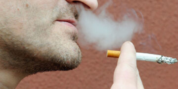 Undated file photo of a man smoking a cigarette. A French study found that only 4.4% of 350 coronavirus patients hospitalized were regular smokers and 5.3% of 130 homebound patients smoked. This pales in comparison with at least 25% of the French population that smokes. Researchers theorized nicotine could prevent the virus from infecting cells or that nicotine was preventing the immune system from overreacting to the virus. To test this theory, hospitalized coronavirus patients, intensive care patients and frontline workers nicotine patches. Photo by ANDBZ/Abaca/Sipa USA(Sipa via AP Images)