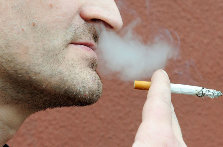 Undated file photo of a man smoking a cigarette. A French study found that only 4.4% of 350 coronavirus patients hospitalized were regular smokers and 5.3% of 130 homebound patients smoked. This pales in comparison with at least 25% of the French population that smokes. Researchers theorized nicotine could prevent the virus from infecting cells or that nicotine was preventing the immune system from overreacting to the virus. To test this theory, hospitalized coronavirus patients, intensive care patients and frontline workers nicotine patches. Photo by ANDBZ/Abaca/Sipa USA(Sipa via AP Images)