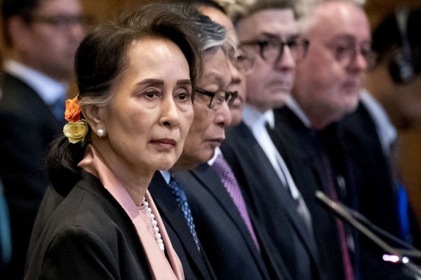 TOPSHOT - Myanmar's State Counsellor Aung San Suu Kyi stands before UN's International Court of Justice on December 10, 2019 in in the Peace Palace of The Hague, at the start of a three-day hearing on Rohingya genocide case. - The case, brought by the west African state of Gambia, is the first attempt to bring Myanmar to justice over its bloody 2017 military crackdown on the Rohingya Muslim minority. (Photo by Koen Van WEEL / ANP / AFP) / Netherlands OUT (Photo by KOEN VAN WEEL/ANP/AFP via Getty Images)
