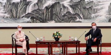 US Deputy Secretary of State Wendy Sherman and Chinese Foreign Minister Wang Yi sit together in Tianjin, China on Monday.(AP Photo)