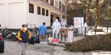 Students are checking for Covid protocols at the school hall.