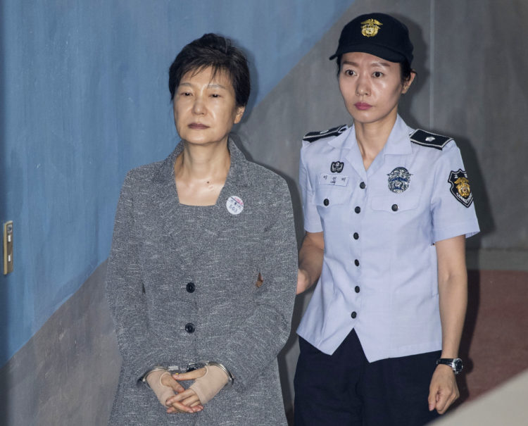 File photo of Park Geun-hye, former president of South Korea, (Left), being escorted by prison officer as she arrives at the Seoul Central District Court in Seoul, South Korea on August 25, 2017.