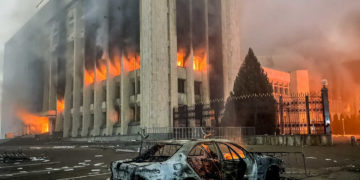 ALMATY, KAZAKHSTAN - JANUARY 5, 2022: A burnt car is seen by the mayors office on fire. Protests are spreading across Kazakhstan over the rising fuel prices; protesters broke into the Almaty mayors office and set it on fire. Valery Sharifulin/TASS (Photo by Valery SharifulinTASS via Getty Images)