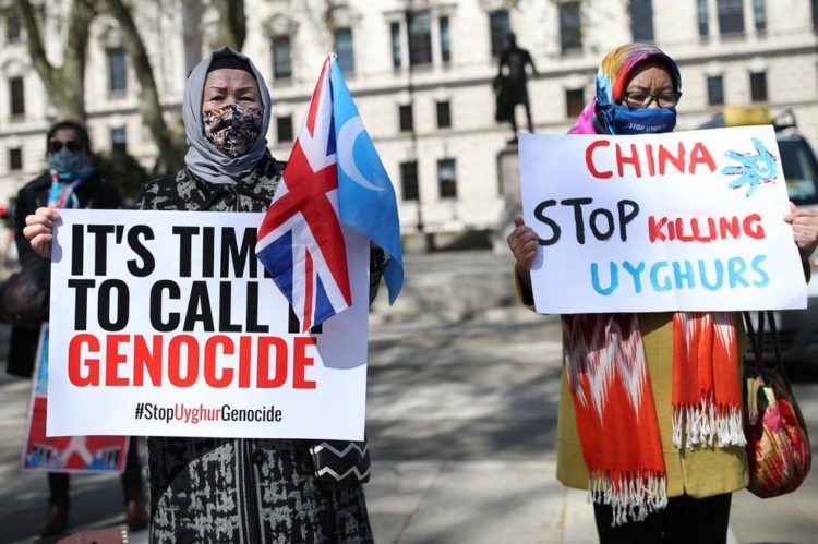 Uyghurs have staged protests in London urging the government to accuse China of genocide. PA Media