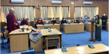 Speaker Khenpo Sonam Tenphel of the Tibetan Parliament-in-Exile administering the oath of office to the new Parliament member Ms. Tenzin Choezin.