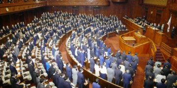 Lawmakers stand up to show their support as Japan's parliament adopts resolution on human rights in China at the lower house of the parliament in Tokyo, Japan February 1, 2022, in this photo taken by Kyodo. Mandatory credit Kyodo/via REUTERS