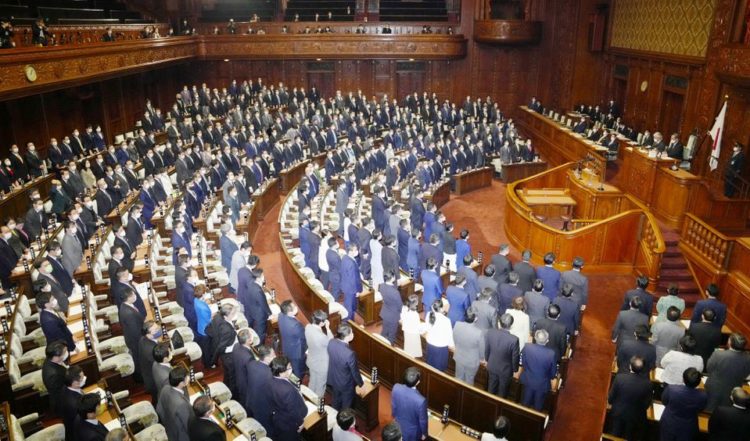 Lawmakers stand up to show their support as Japan's parliament adopts resolution on human rights in China at the lower house of the parliament in Tokyo, Japan February 1, 2022, in this photo taken by Kyodo. Mandatory credit Kyodo/via REUTERS