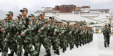 Chinese military-marching infront of the Potala Palace, Lhasa, Tibetan Capital City.