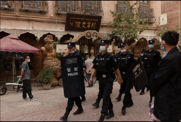Police officers patrol in the old city in Kashgar, Xinjiang in the Uighur Autonomous Region in China [File: Thomas Peter/Reuters]