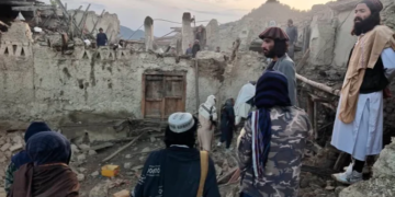 Afghans look at destruction caused by an earthquake in the province of Paktika, eastern Afghanistan [Bakhtar News Agency via AP]