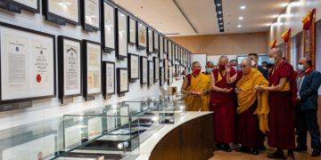 His Holiness the Dalai Lma looking at some of the awards and certificates he received displayed in the gallery at the new Dalai Lama Library and Archive in Dharamsala, HP,  India on July 6, 2022. Photo by Tenzin Choejor