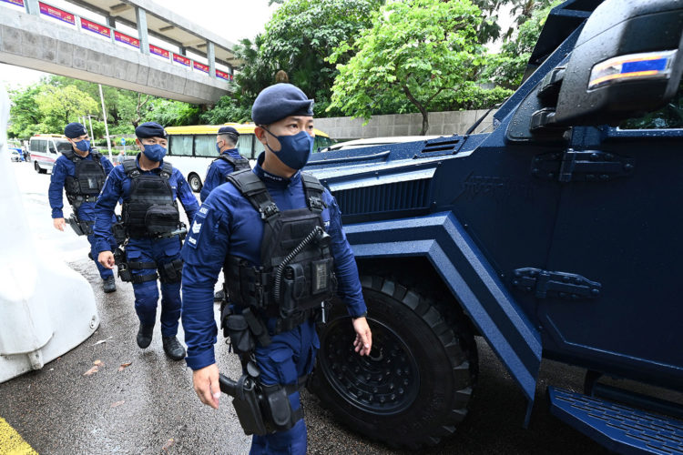 A special unit of the Hong Kong police provides security in the city's Wanchai district on June 30, 2022, as Chinese President Xi Jinping arrives in Hong Kong to attend celebrations marking the 25th anniversary of the city's handover from Britain to China. (Photo by Peter PARKS / AFP) (Photo by PETER PARKS/AFP via Getty Images)