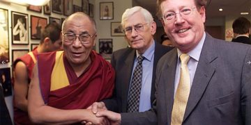 His Holiness the Dalai Lama greets then Northern Ireland First Minister David Trimble and Deputy First Minister Seamus Mallon at Belfast in 2000.