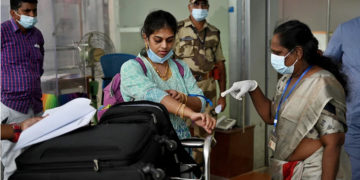 Health workers screen passengers arriving from abroad for Monkeypox symptoms at Anna International Airport terminal in Chennai. (Photo: AFP)