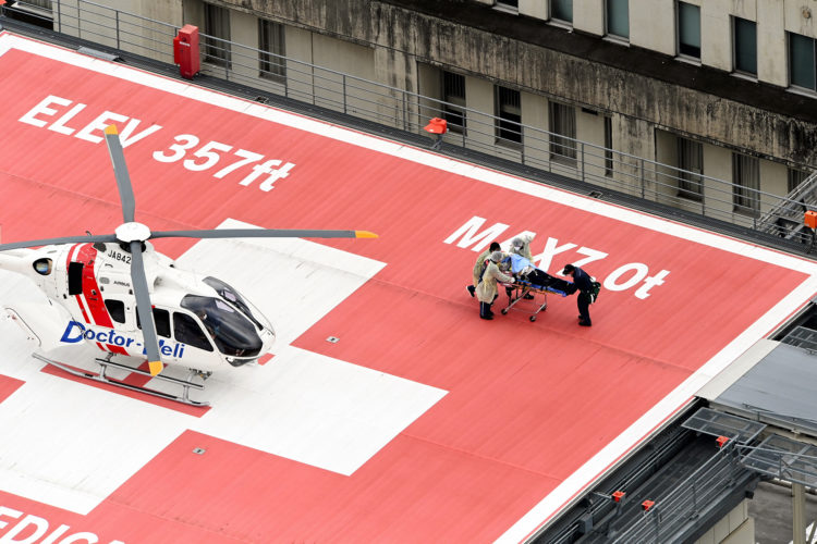NARA, JAPAN - JULY 08: In this aerial image, former Prime Minister Shinzo Abe is on a stretcher to a helicopter after being shot in front of Yamatosaidaiji Station on July 8, 2022 in Nara, Japan. Abe is shot while making a street speech for upcoming Upper House election. (Photo by The Asahi Shimbun via Getty Images)