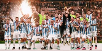 Players of the Argentina national football team lifting the World Cup trophy.