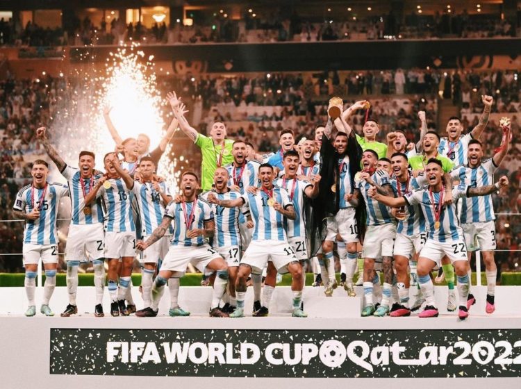 Players of the Argentina national football team lifting the World Cup trophy.