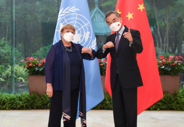 Chinese Foreign Minister Wang Yi with the UN High Commissioner for Human Rights Michelle Bachelet in Guangzhou, in southern China’s Guangdong province, May 23, 2022. photo: Xinhua News Agency