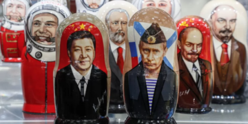 Russian matryoshka dolls with portraits of the Chinese and Russian presidents have been on sale in Moscow