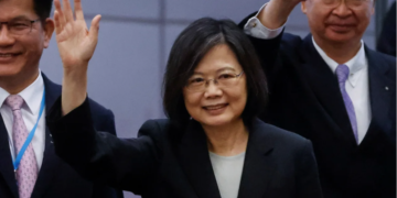 Taiwan's President Tsai Ing-wen waves near the boarding gate as she departs for a 10-day international trip on March 29, 2023.