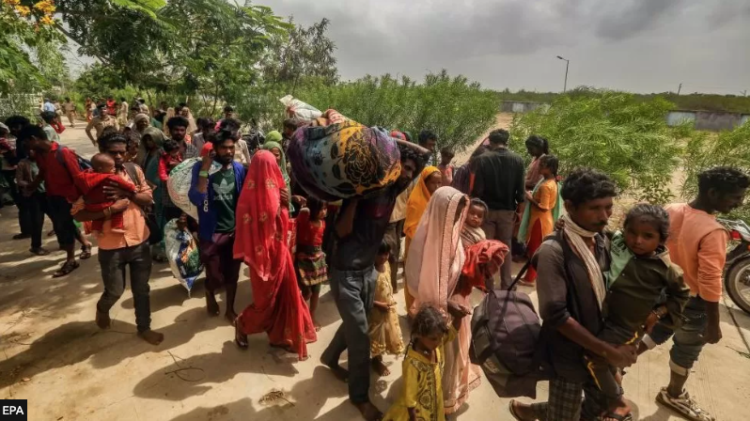 More than 100,000 people in India and Pakistan have been evacuated from the path of a fierce cyclone