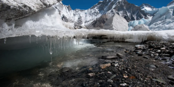 Water drips under Nepal's Khumbu glacier as the ice melts. Courtesy Alex Treadway/ICIMOD