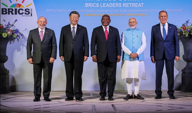 Brics leaders, including China’s president Xi Jinping pose for a group photograph. Xi unexpectedly missed a speech on Tuesday and was replaced with his commerce minister. Photograph: Russian Foreign Ministry Press Service/EPA