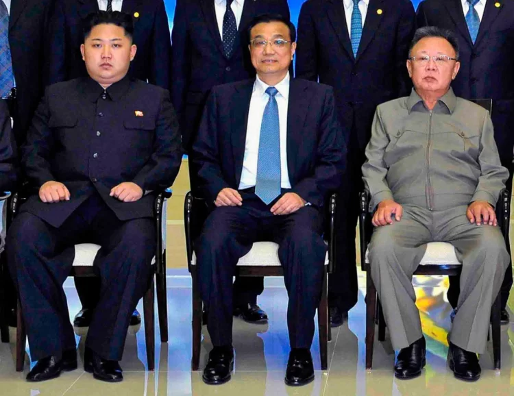 North Korean leader Kim Jong-il and his son Kim Jong-un pose for photographs with Chinese vice premier Li Keqiang in 2011. Photo: Reuters