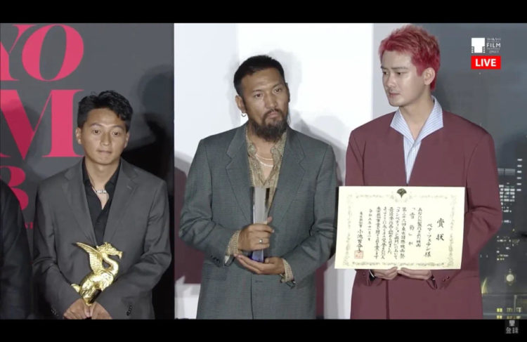 འཁྲབ་སྟོན་པ་སྦྱིན་པ་རྒྱ་མཚོ་སོགས། ༢༠༢༣ ལོའི་ཊོག་ཡོའི་གློག་བརྙན་དུས་སྟོན་སྐབས། ༢༠༢༣། ༡༡། ༡ དྲ་ལམ་གྱི་པར།