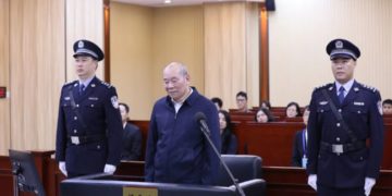 Xu Guojun, former head of a Bank of China sub-branch in Guangdong province, stands trial. [Photo/Jiangmen Intermediate People's Court in Guangdong province]