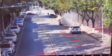 Smoke spreads on a road following an explosion after artillery shells fell in Nansan, Yunnan Province, China, in this screengrab obtained from a video of surveillance footage, released on January 3, 2024. Video Obtained By Reuters
