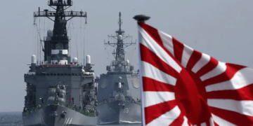 A ship of the Japanese Maritime Self-defence Force sails in formation during a naval fleet review. GETTY IMAGES
