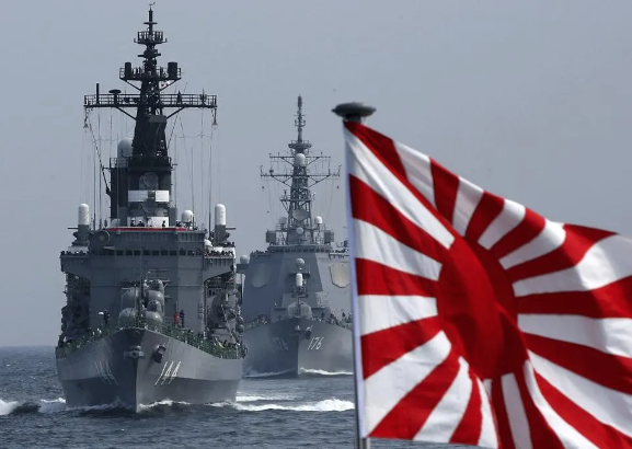 A ship of the Japanese Maritime Self-defence Force sails in formation during a naval fleet review. GETTY IMAGES