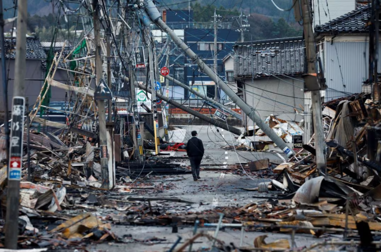 Debris accumulates along Asaichi-dori street, which burned down due to a fire following an earthquake, in Wajima, Japan, January 4, 2024. REUTERS/Kim Kyung-Hoon