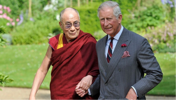 His Holiness the Dalai Lama and Prince Charles walking on the grounds of Clarence House in London, UK, on June 21, 2012.