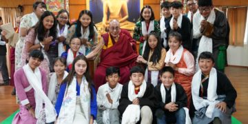 His Holiness the Dalai Lama posing for a group photo with the students of Summer Camp program 2019,Photo/Tenzin Choejor/Office of His Holiness the Dalai Lama.