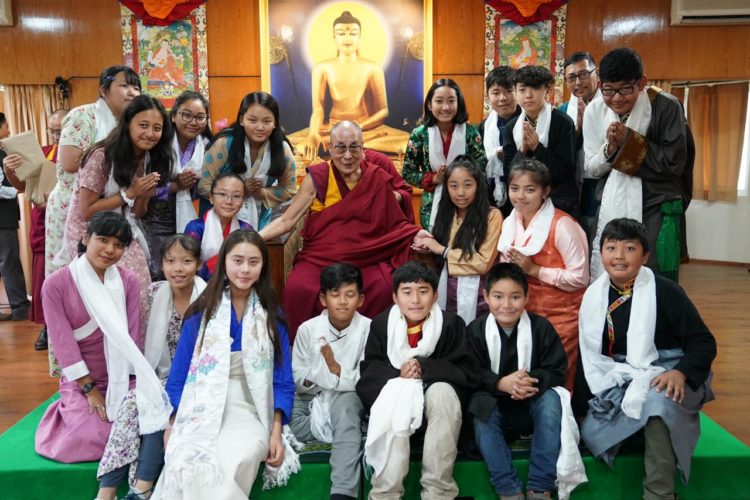 His Holiness the Dalai Lama posing for a group photo with the students of Summer Camp program 2019,Photo/Tenzin Choejor/Office of His Holiness the Dalai Lama.