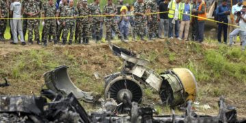 Nepal army personnel stand by a plane crash site at Tribhuvan International Airport in Kathmandu, Nepal, on July 24, 2024. State television in Nepal says a plane has slipped off the runway and crashed while trying to take off from the Kathmandu airport. | Photo Credit: AP